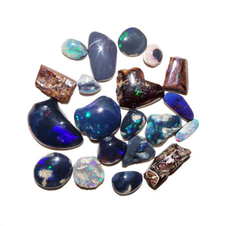 Many polished australian opal stones on white backgroundの写真素材