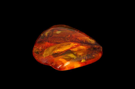 Baltic amber closeup on black background