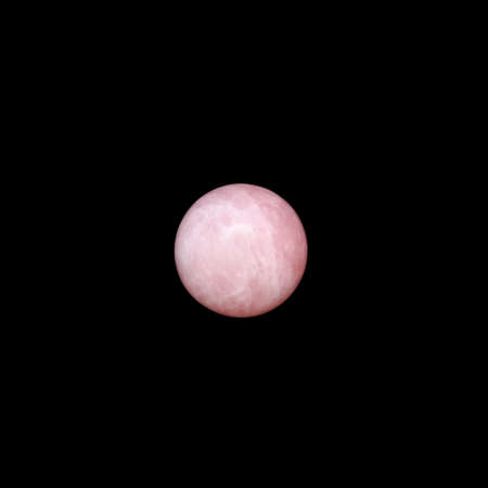Natural rose quartz ball on black backgroundの写真素材