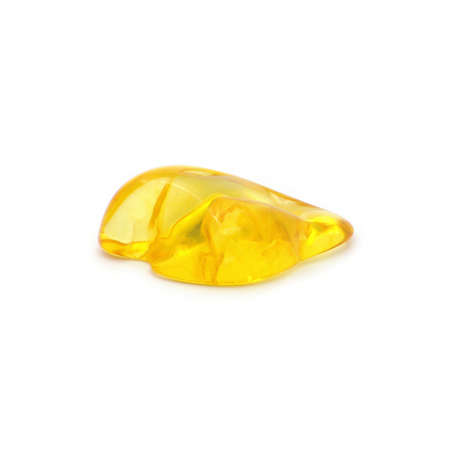 Natural yellow baltic amber on white backgroundの写真素材