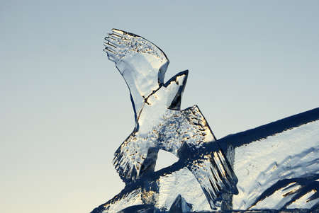 Sculpture of a bird made of ice close-upの写真素材