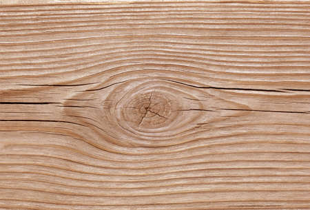Brown pine board with knot pattern and cracks textureの写真素材