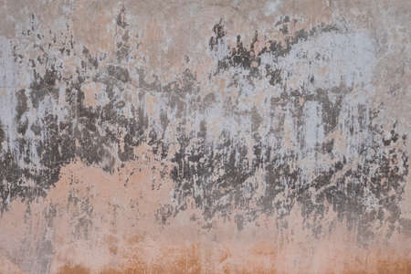 Peeling and cracked wall of an old house, grunge backgroundの写真素材