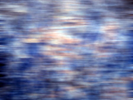 Abstract background of blurred horizontal lines in blue and orange toneの写真素材