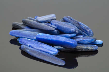 Natural blue kyanite stones on dark backgroundの写真素材