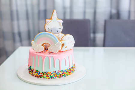 Cake birthday girl with figure 2, figure rainbow and unicornの写真素材
