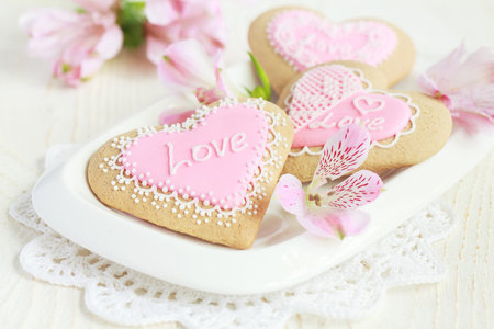 Heart-shaped cookies for Valentine's Day, on white wooden backgroundの写真素材