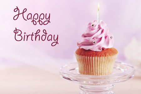Delicious cupcake on pink background. Happy Birthday conceptの写真素材