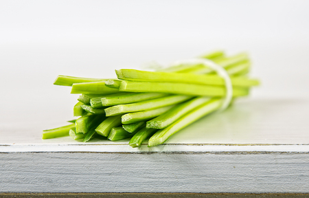 Leek stripes on the white woodの写真素材