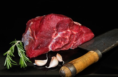 Beef with garlic, herbs and meat chopperの写真素材
