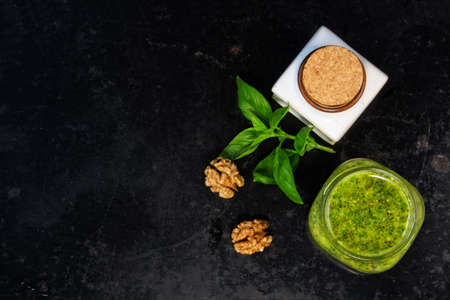 Basil pesto with the walnuts and herbs on  blackの写真素材