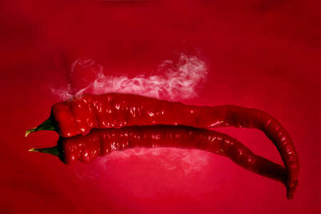 Reflection of red pepper with the smokeの写真素材