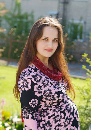 The pregnancy woman walk in the parkの写真素材