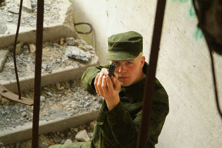 The soldier with a pistol performs antiterrorist operation.の写真素材