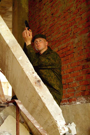 The soldier with a pistol performs antiterrorist operation.の写真素材