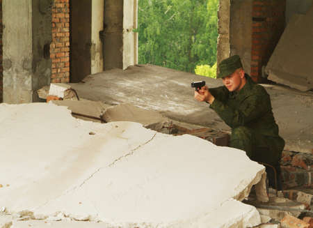 The soldier with a pistol performs antiterrorist operation.の写真素材