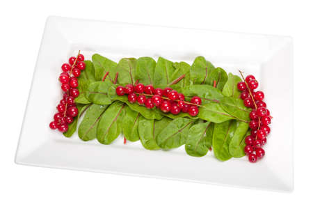 Salad of beetroot leaves and various fruitsの写真素材