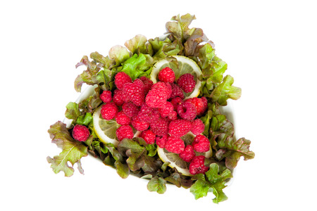 Sweet raspberry with a green salad and lemon