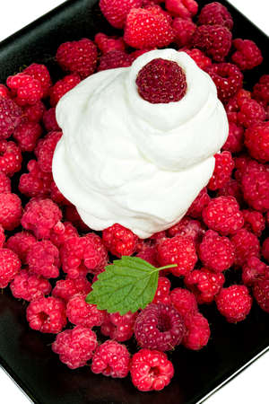 Raspberries with whipped cream is a delicate dessert