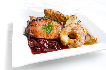 Roast meat with plum chutney and pearsの写真素材