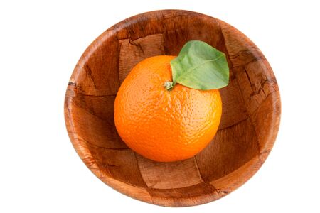 Single mandarin in wooden bowl - Isolatedの写真素材