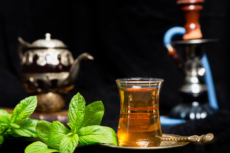 Mint tea traditional Arabian drink on black backgroundの写真素材