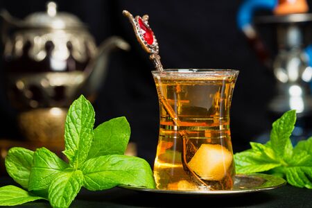 Mint tea traditional Arabian drink on black backgroundの写真素材