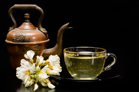 Acacia honey - honey in a bowl and acacia flowersの写真素材