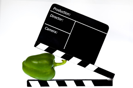 Green pepper and film flap - white backgroundの写真素材