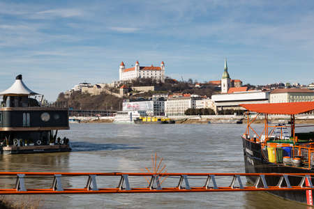 Bratislava, Slovakia - 07 February 2016: Bratislava Castle and St. Martin's Cathedral in Bratislava. View over the Danube River.のeditorial素材