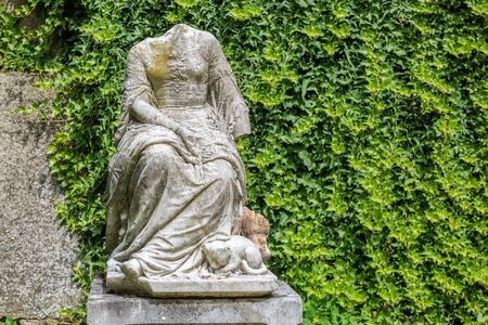 Statue without head with a kitten in Castle in Dolna Krupa, Slovakia. The seat of Music Museum.のeditorial素材