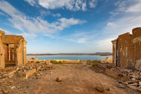Ruins of a house on the shore Water reservoirs El Mansour Eddahbi in Moroccoの写真素材
