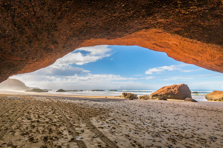 The seaside Legzira in Morocco is known for its famous rock formations.の写真素材