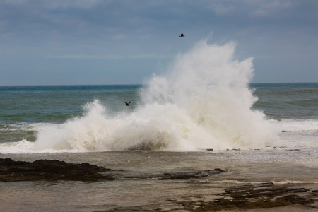 Stormy Atlantic under the cliffs on coast near Rabat-Sale, Moroccoの写真素材