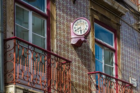 Typical decoration of the facade of the house in Lisbon. Traditional ceramic tiles azulejos.の写真素材