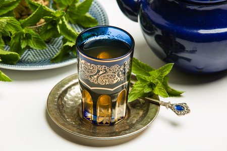Traditional Arab mint tea in a traditional cup with mint leavesの写真素材