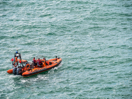 Carvoeiro , Portugal - October 20, 2017: Rescue boat patrols near Carvoeiro on the southern Atlantic coast of Portugal.のeditorial素材