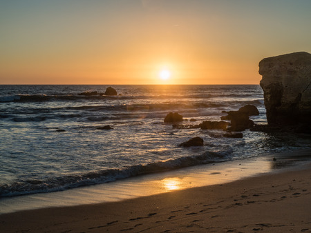The sandy beach at Gale in the sunset on the southern Portuguese coast of the Atlantic.の写真素材