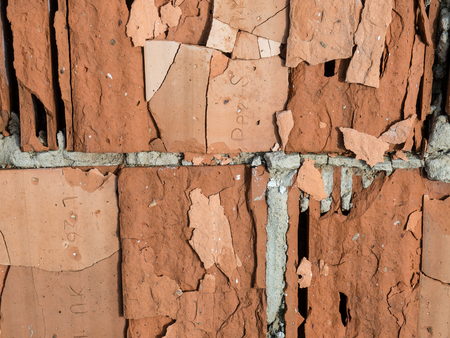 Old bricks from the demolished house. Environmental burden of wild landfill.