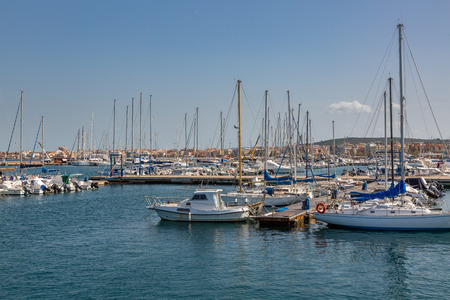 In the port of the old town of Alghero on the island of Sardiniaの写真素材