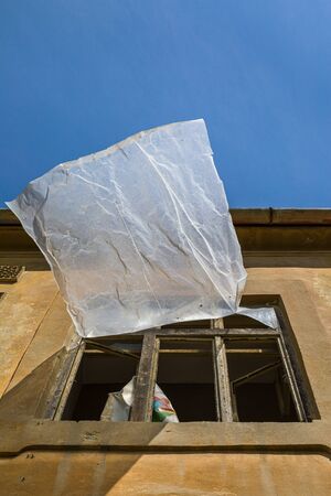 Breeze in the window. Dilapidated mansion in the village of Jablonica, Slovakia.