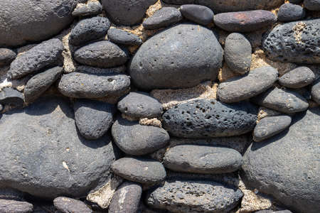 Lava rocks and sand of vulcanic Lanzarote islandの写真素材