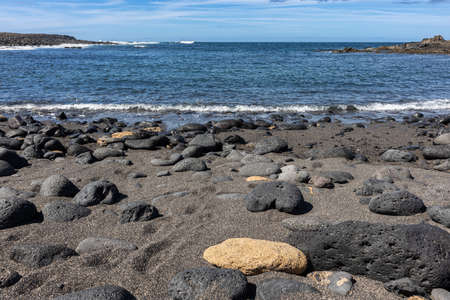 Lava rocks and sand of vulcanic Lanzarote island