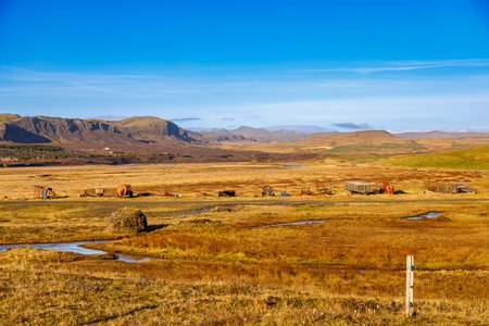 Autumn fields with agricultural machinery in the south of Icelandの写真素材