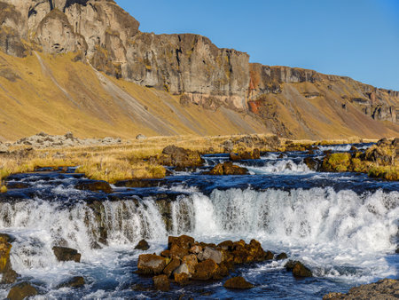 Waterfall and landscape under Lake Torutjorn in Icelandの写真素材