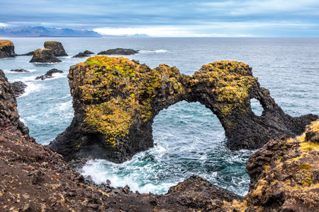 Cliffs on the coast of Arnarstapi on the island of Iceland in the North Atlanticの写真素材