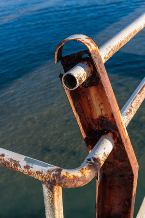 Old pier in the harbor bay near the village of Roda on the island of Corfu, Greeceの写真素材
