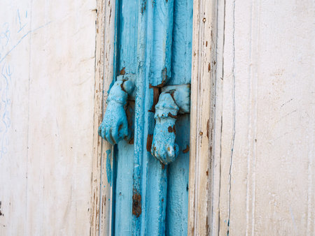 A sunlit stroll through the narrow alleys of Kairouanâs UNESCO-listed Medina. The historic architecture and vibrant blue doors capture the authentic spirit and timeless charm of Tunisiaâs spiritual heart under a clear winter sky.の写真素材