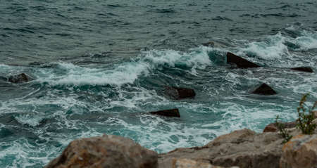 Waves breaking on rocks, Tarragonaの写真素材
