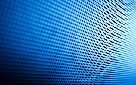 This is a perspective close up of a modern plasma tv speaker grill.  Almost couldnt tell?の写真素材